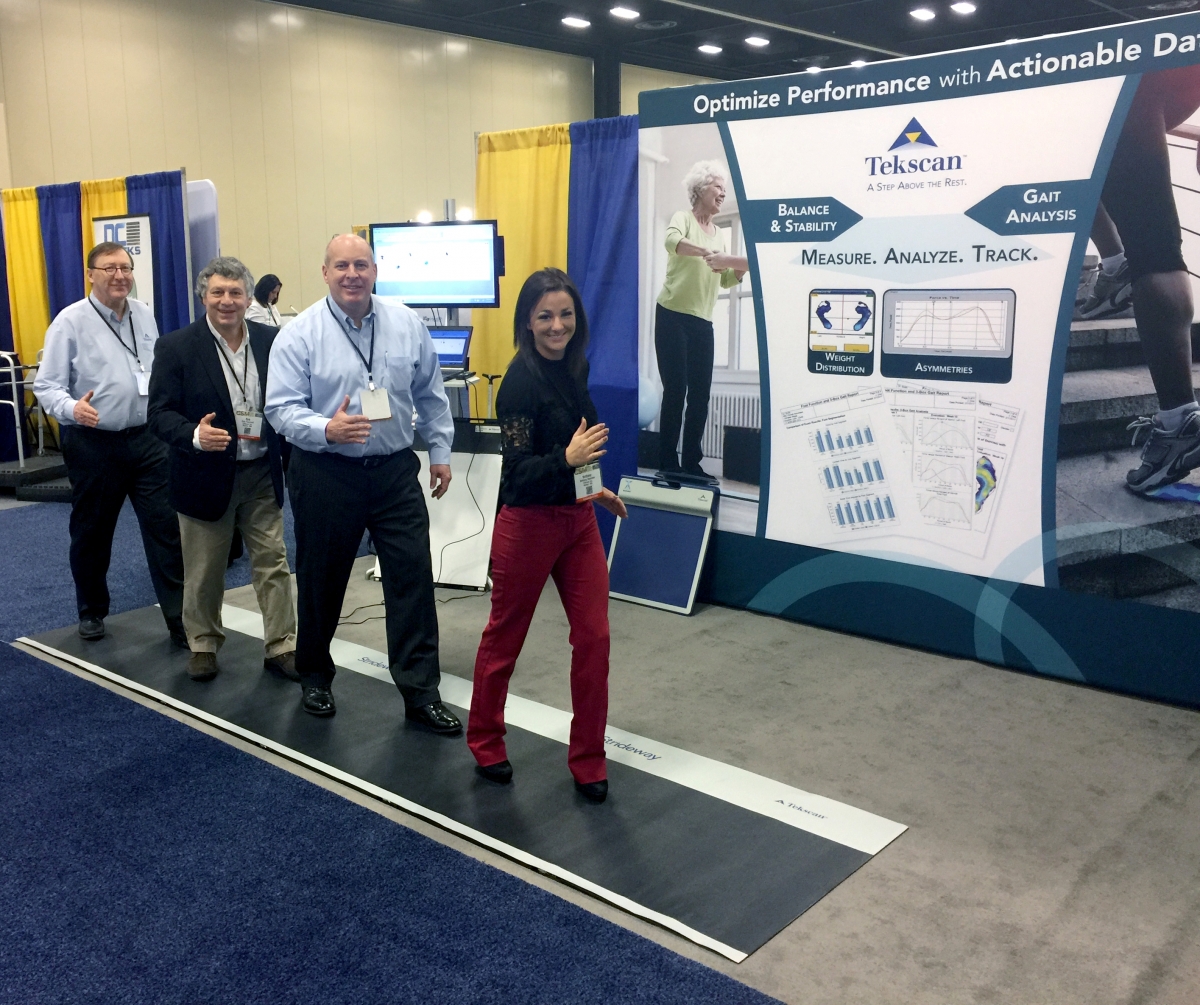 The Tekscan Team posing for a picture on the Strideway at APTA.